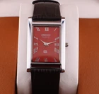 Vintage Seiko Slim Quartz Men's Wrist Watch Red Dial with Dark Brown Strap.