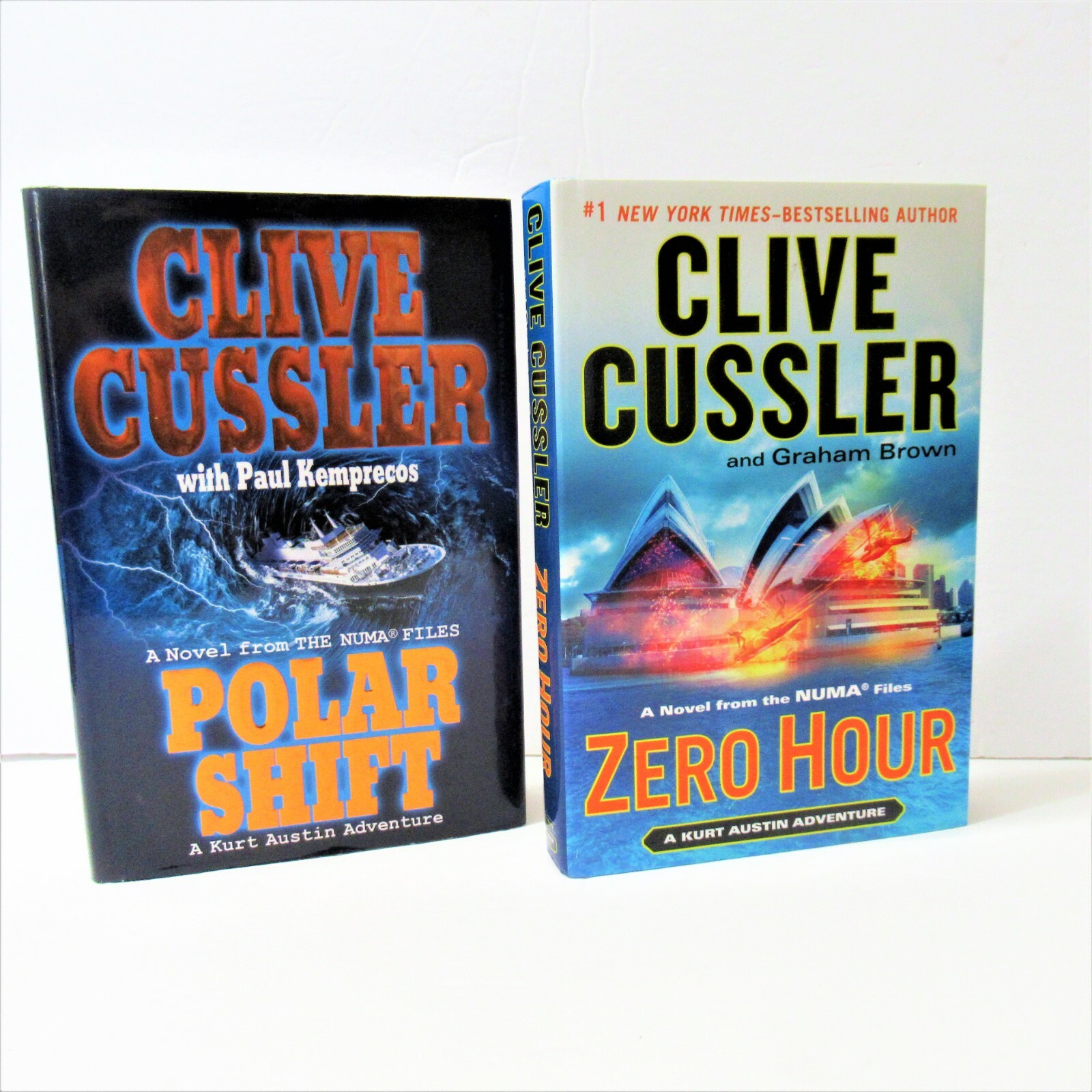 TWO (2) CLIVE CUSSLER HARDCOVER BOOKS ZERO HOUR, POLAR SHIFT, ACTION