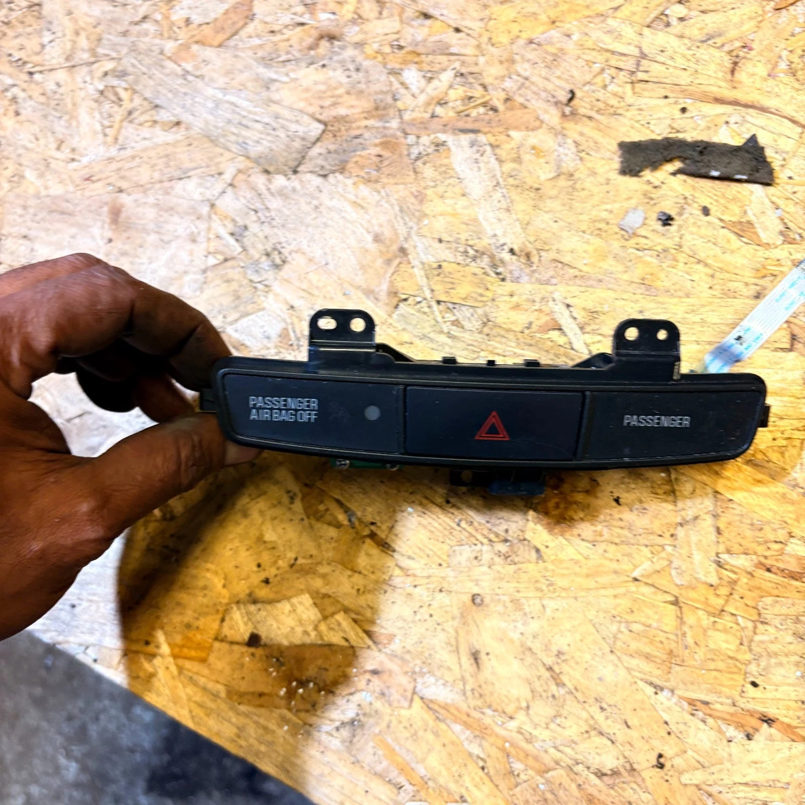 Actual Mitsubishi Lancer dashboard hazard switch panel close view