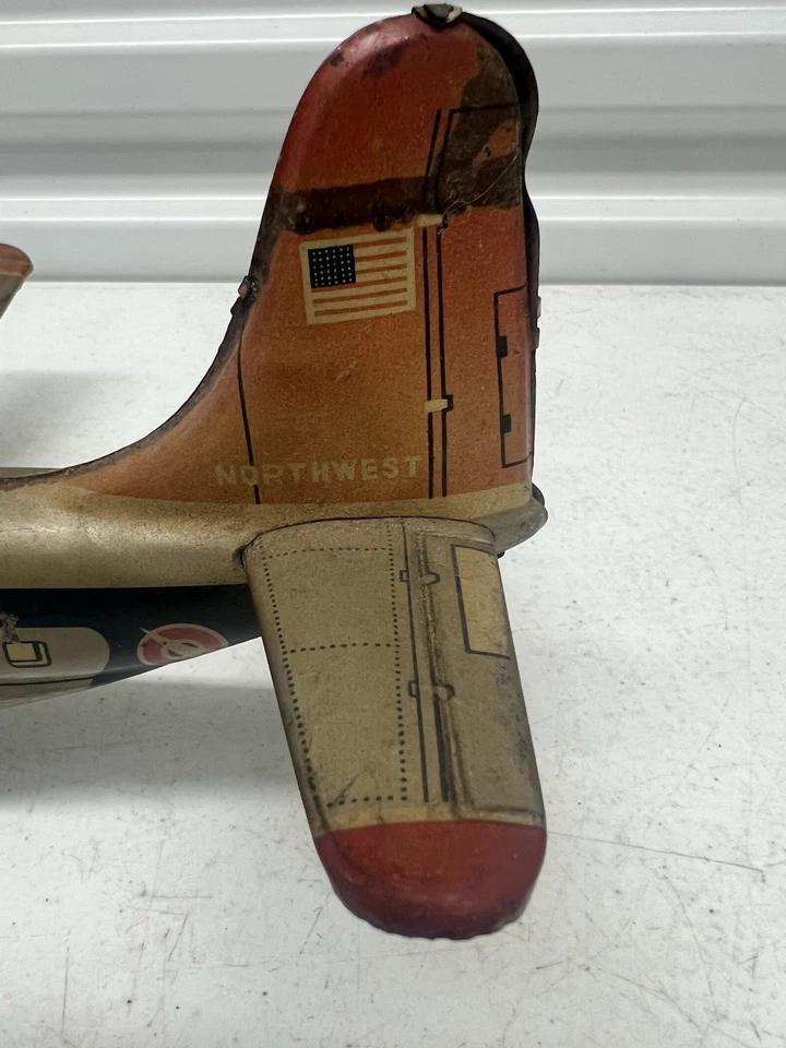 Avión de juguete de hojalata vintage Tin NW Airlines NWA Japón cuerda Northwest Airlines Foto 3 de 4