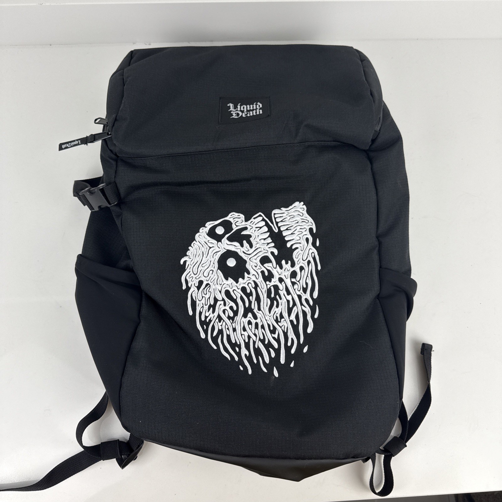 Liquid Death Backpack Cooler Black White Skull Graphic