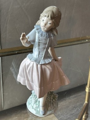 Porcelain figurine titled 'Surprised Girl' by NAO (Lladró)