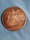 One Troy Oz .999 Fine Silver round with Seated Liberty OBV, Shield REV