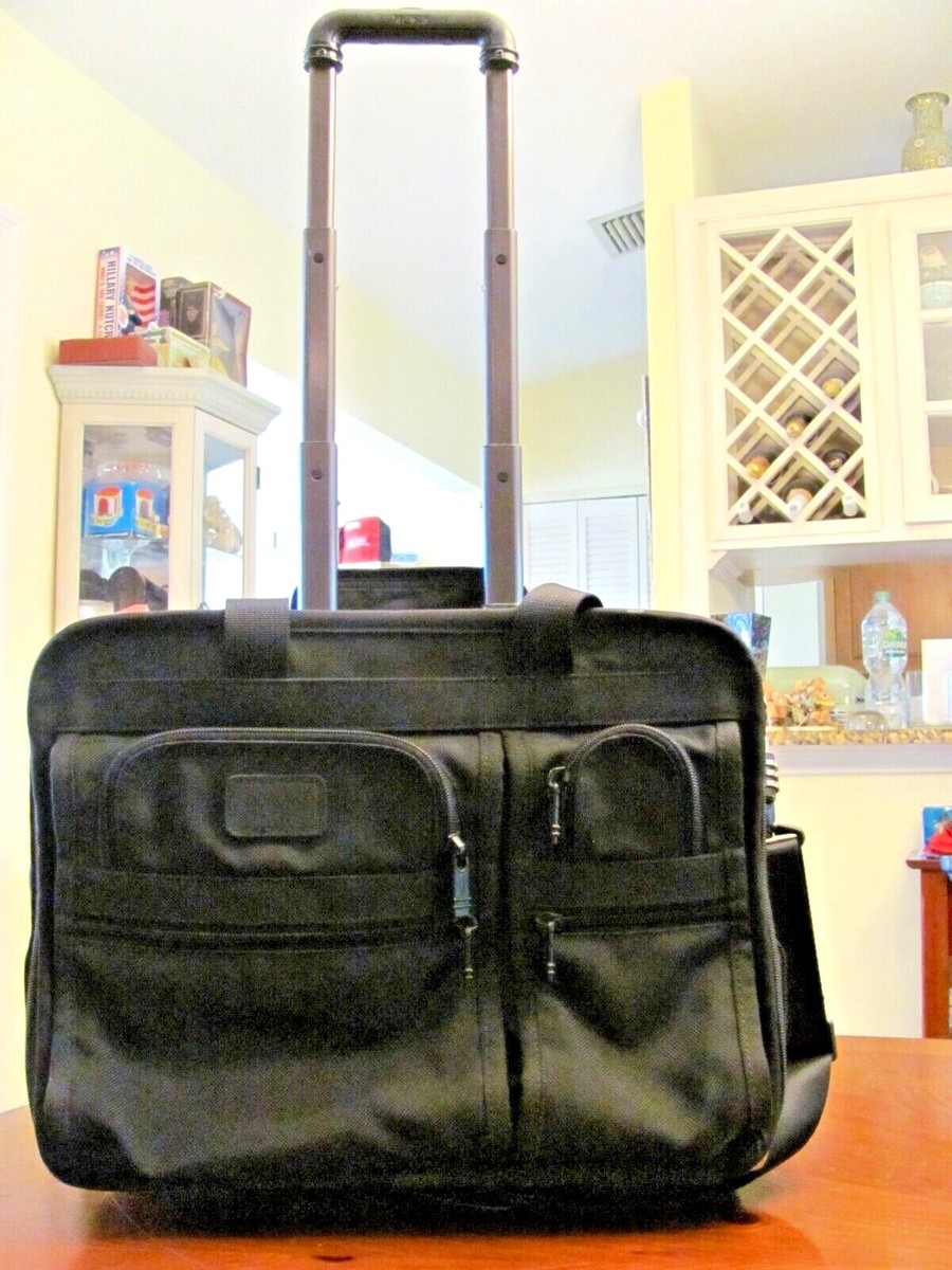 TUMI BLACK BALLISTIC NYLON 2 HANDLE 2 WHEELED ROLL OVERNIGHT