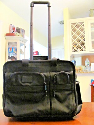 TUMI BLACK BALLISTIC NYLON 2 HANDLE 2 WHEELED ROLL OVERNIGHT