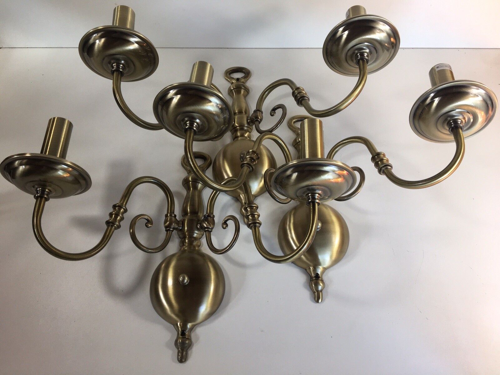 A Set Of Flemish Double Arm Wall Brass Lights