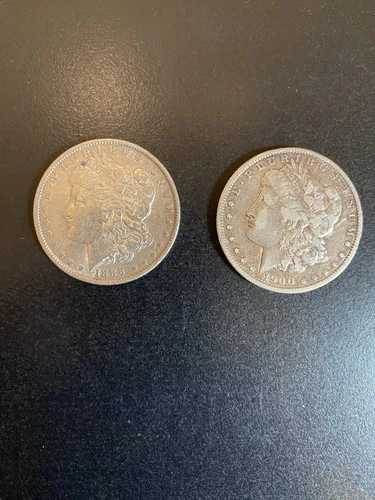 Lot of 2 Morgan silver dollars: 1888, 1900 O circulated, very good