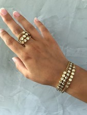 Anello e bracciale GLAMSTONES Swatch Bijoux in acciaio dorato e cristalli, nuovi