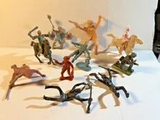 Lot of assorted plastic playset figures from different sets.