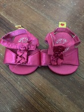 Tacones Build A Beat rosa satinado con lazo rosa