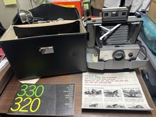Vintage Polaroid 320 Automatic Land Camera with Flash, Case  Booklets