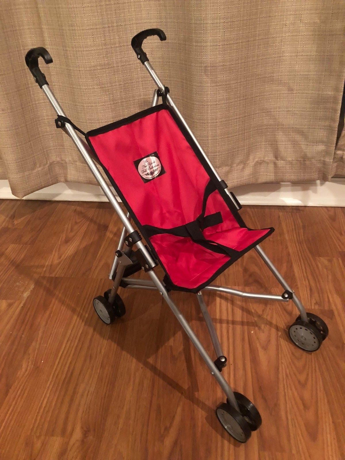 red doll stroller