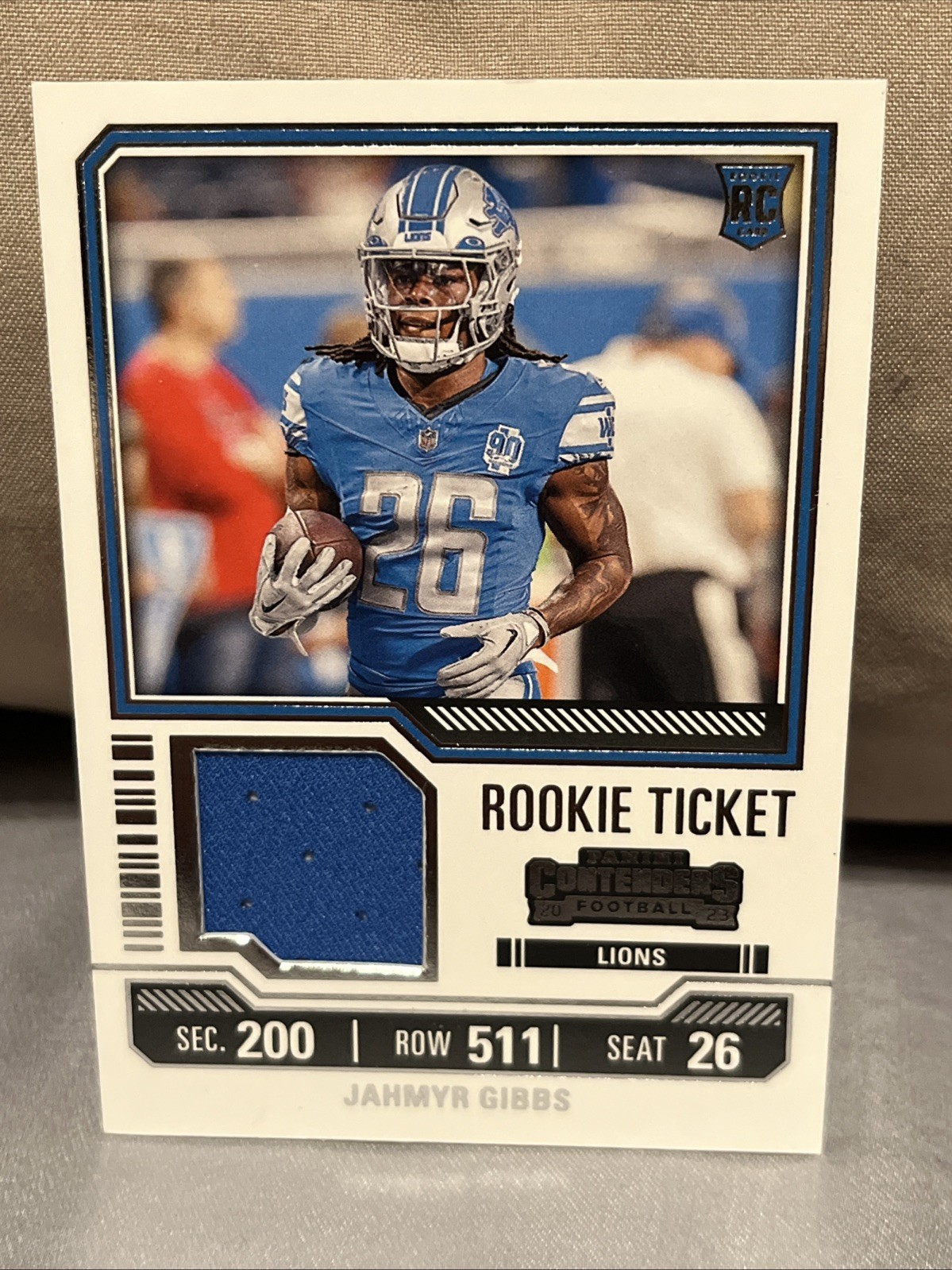 2023 Panini Contenders - Rookie Ticket Swatches Jahmyr Gibbs #TS12 (MEM, RC)