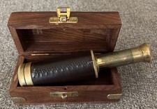 Vintage small brass and leather nautical spyglass, monocular telescope.