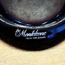The MONTELEONE Hotel Ashtray New Orleans Purple Glass 4.25" Diameter Advertising