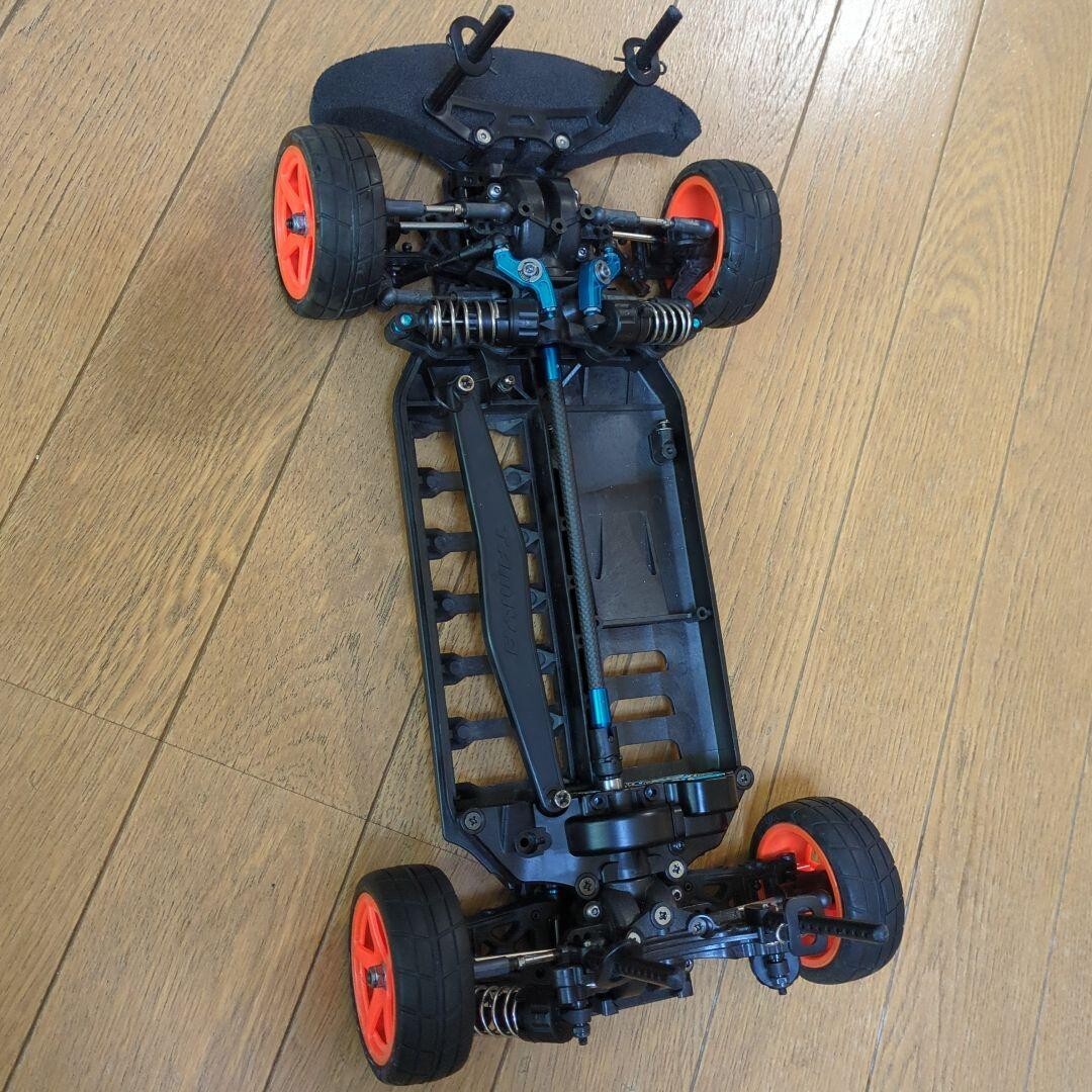 TAMIYA TB03 RC car chassis with upgrade options for radio control enthusiasts