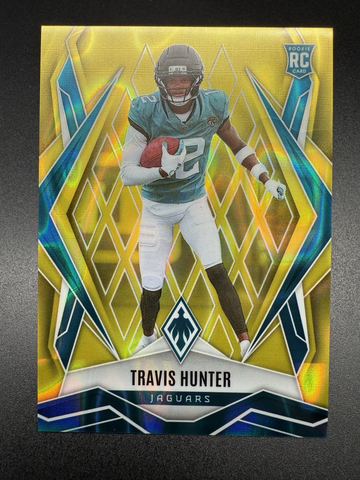 2025 Panini Phoenix #157 Travis Hunter Yellow Lava /125 Rookie RC Jaguars
