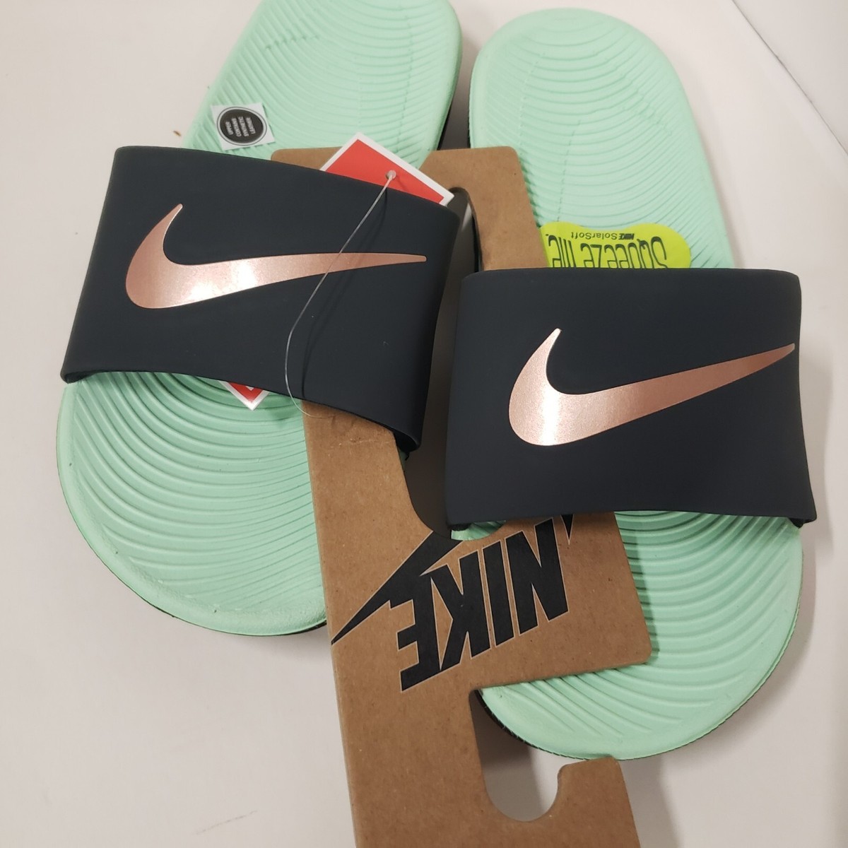 mint green nike sandals