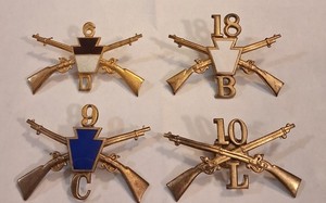 LOT OF 4 SPANISH AMERICAN WAR INFANTRY INSIGINA