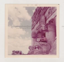 Handsome Shirtless Young Man Posing Among the Ruins of Ancient Mayan Structure