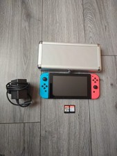 Nintendo Switch 32GB Handheld Console With 2 Games, Carry Case & Charger Bundle