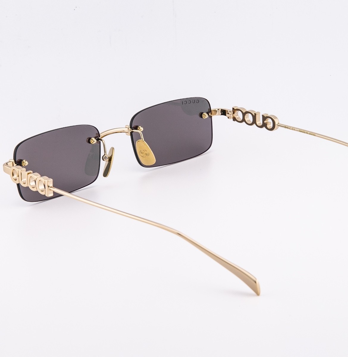 Gucci GG1808S 004 Silver Stones Red Lens Sunglasses Rimless Unisex