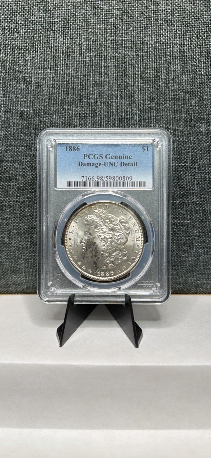 1886 Morgan Silver Dollar PCGS Genuine Damaged Uncirculated Detail Coin
