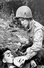 WW2 Picture Photo Normandy US soldier gives water to wounded German 0306
