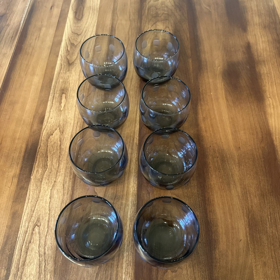 Smokey grey MCM atomic-pattern glasses are the exact mid-century barware aesthetic that interior stylists chase — set of 8 is instantly displayable and usable.