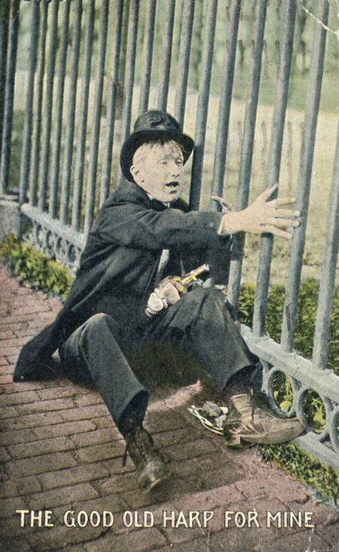 Good Old Harp Sot & His Bottle on the Sidewalk Next to Iron Fence 1914 Postcard