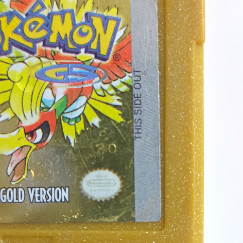 Gold Pristine CIB Game Boy case with Pokémon logo, yellow border, and text “THIS SIDE OUT” on silver edge.