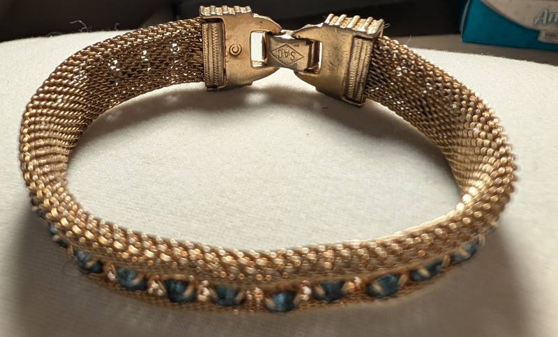Sarah Coventry Gold-Tone Mesh/Blue Rhinestone Bracelet.  6" Long. X  .50" Wide 