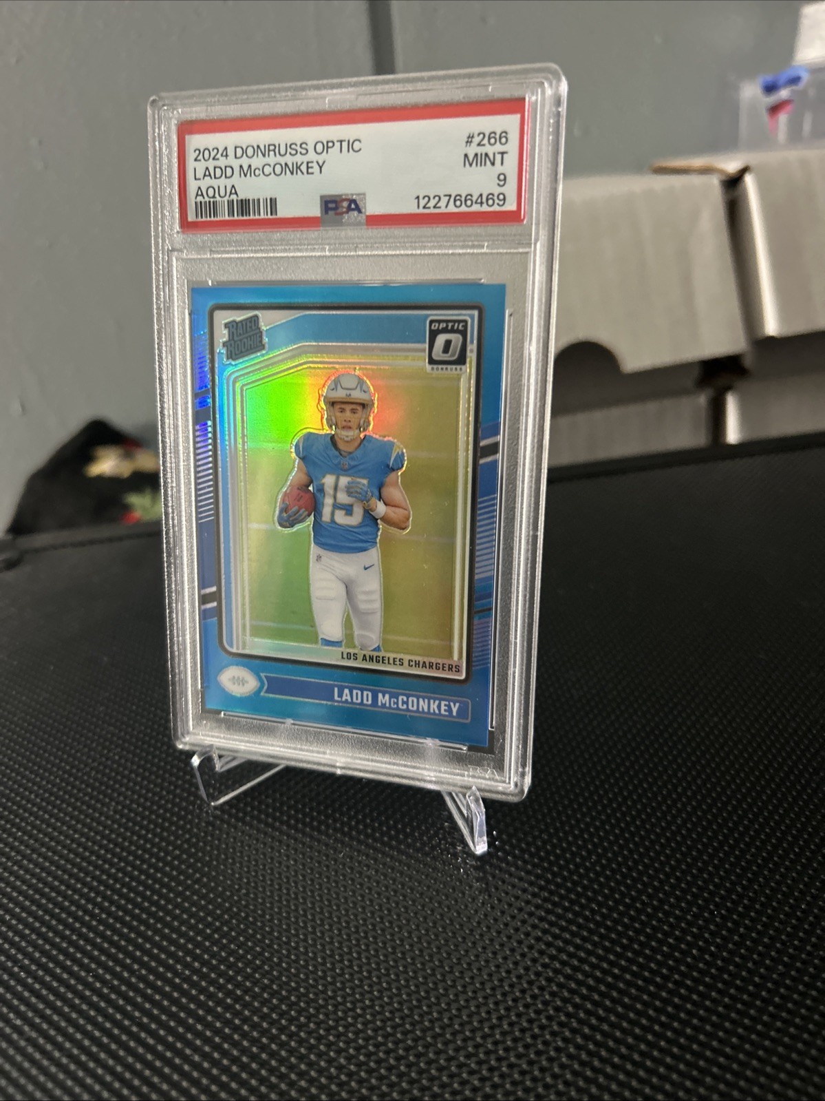 2024 Donruss Optic Rated Rookie Ladd McConkey #266 Aqua Prizm 206/299 (RC) PSA-9