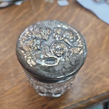 Small cut glass jar with silver repousse lid.  Birmingham 1909. great condition 