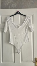 Women White Ribbed Body Suit Short Sleeved With Low Round Neck