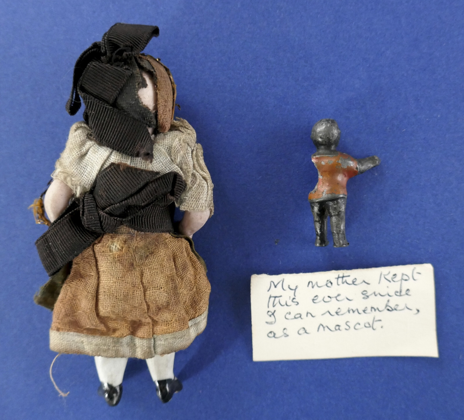 AN ANTIQUE ARTICULATED MINATURE VICTORIAN BISQUE DOLLS HOUSE DOLL & A