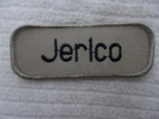 JERICO  USED EMBROIDERED  SEW ON NAME PATCH TAGS BLACK ON TAN