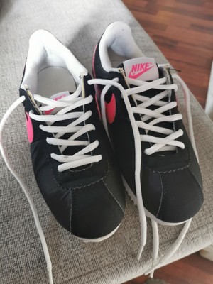 pink black nike trainers