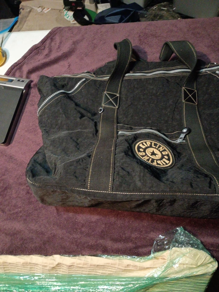 Bolsa de viaje/equipaje Kipling de nailon negra, expandible. Vintage años 90 Foto 2 de 4