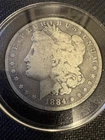 1884 Morgan Dollar Silver  O  $1 Circulated   Capsule Include