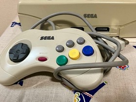 Sega Saturn body with 2 controllers and power memory (Sakura Wars package)