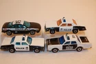 4 Vintage 1970s-1990s Matchbox/Hot Wheels Police Cars PLYMOUTH / MERCURY / OLDS