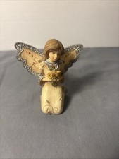 Elements November Kneeling Angel with flowers...