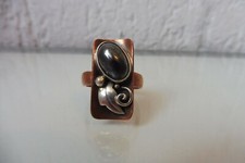 Very beautiful, old designer ring, copper with silver and dark stone, signed