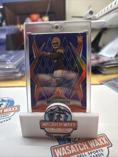 2025 Panini Phoenix - Rookies Shedeur Sanders Auto #154 Blue /49 (RC)