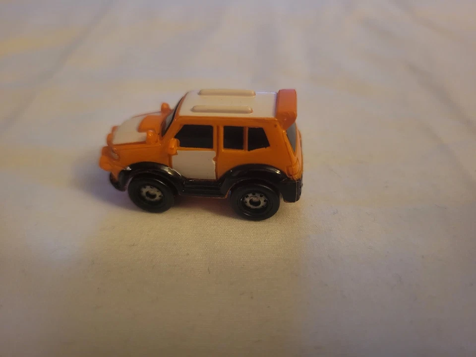 Small Hasbro Micro Machine SUV in Orange and White - Image 3 of 4