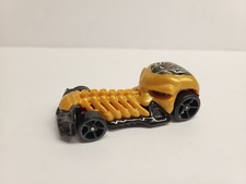 Hot Wheels Skull Crusher 2009 Mattel Gold Black Skeleton Diecast Car 1:64 Scale