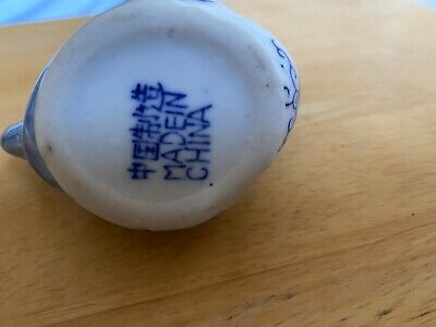 Vintage Small ceramic creamer pitcher with lid. White with Blue Bow on Lid