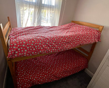 Wooden bunk beds with mattresses