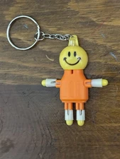 SMOKEBUDDY Keychain White Plastic Smoke Buddy Poseable Happy Smiley Face
